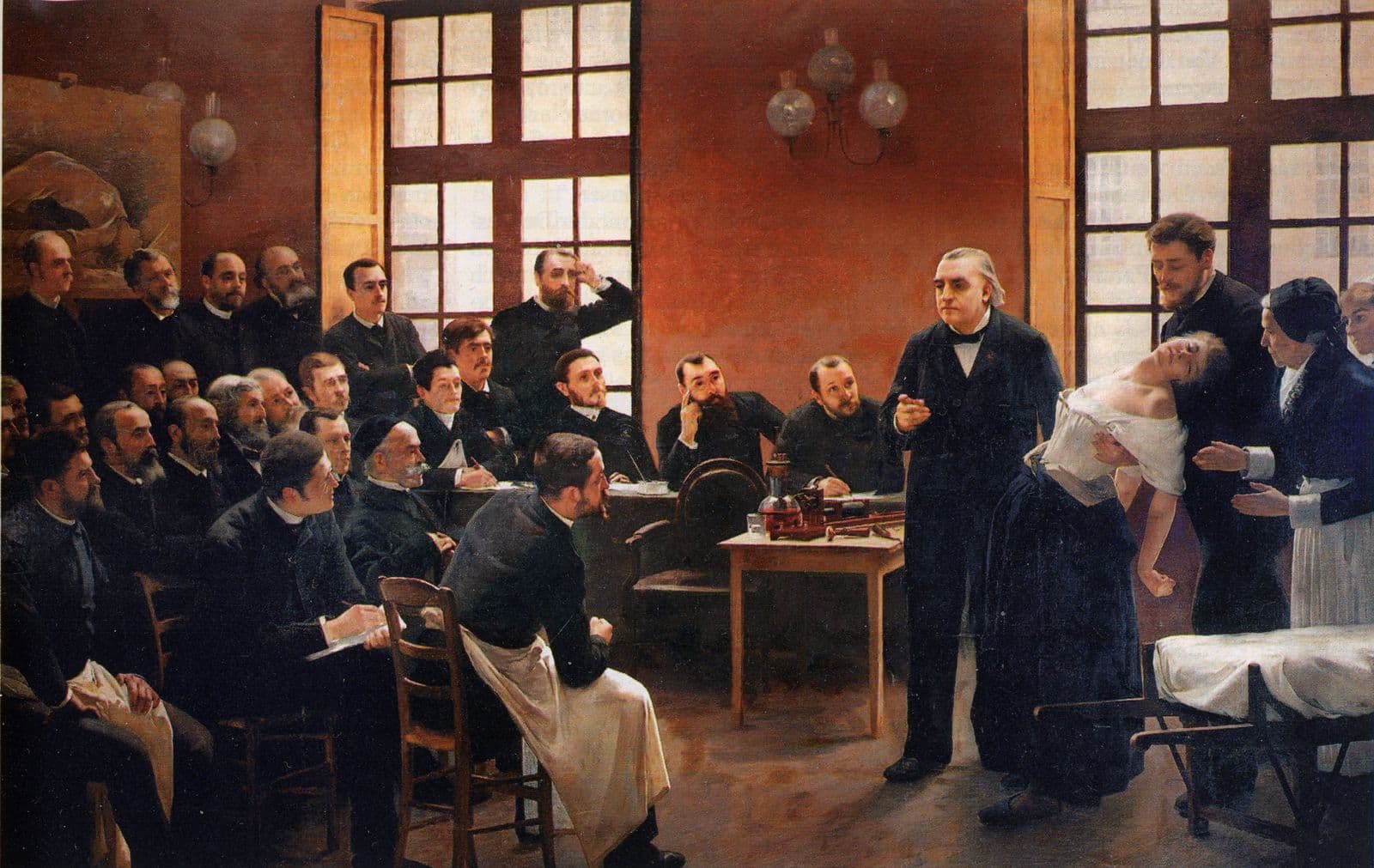 Pintura de um professor apresentando uma paciente a uma sala cheia de médicos.